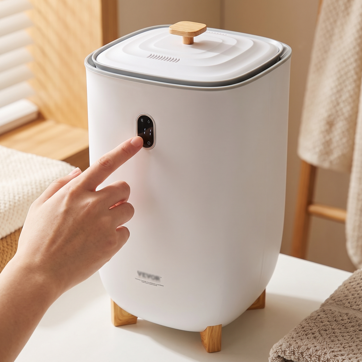 Close-up of the black touch display and wooden lid knob on the 35L towel warmer bucket