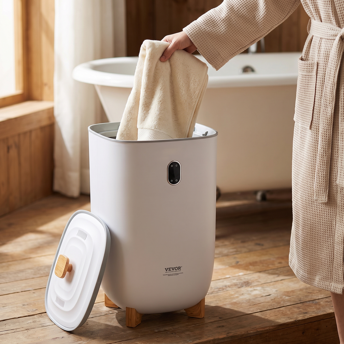Lifting a warm towel out of the 35L towel warmer bucket beside the bathtub