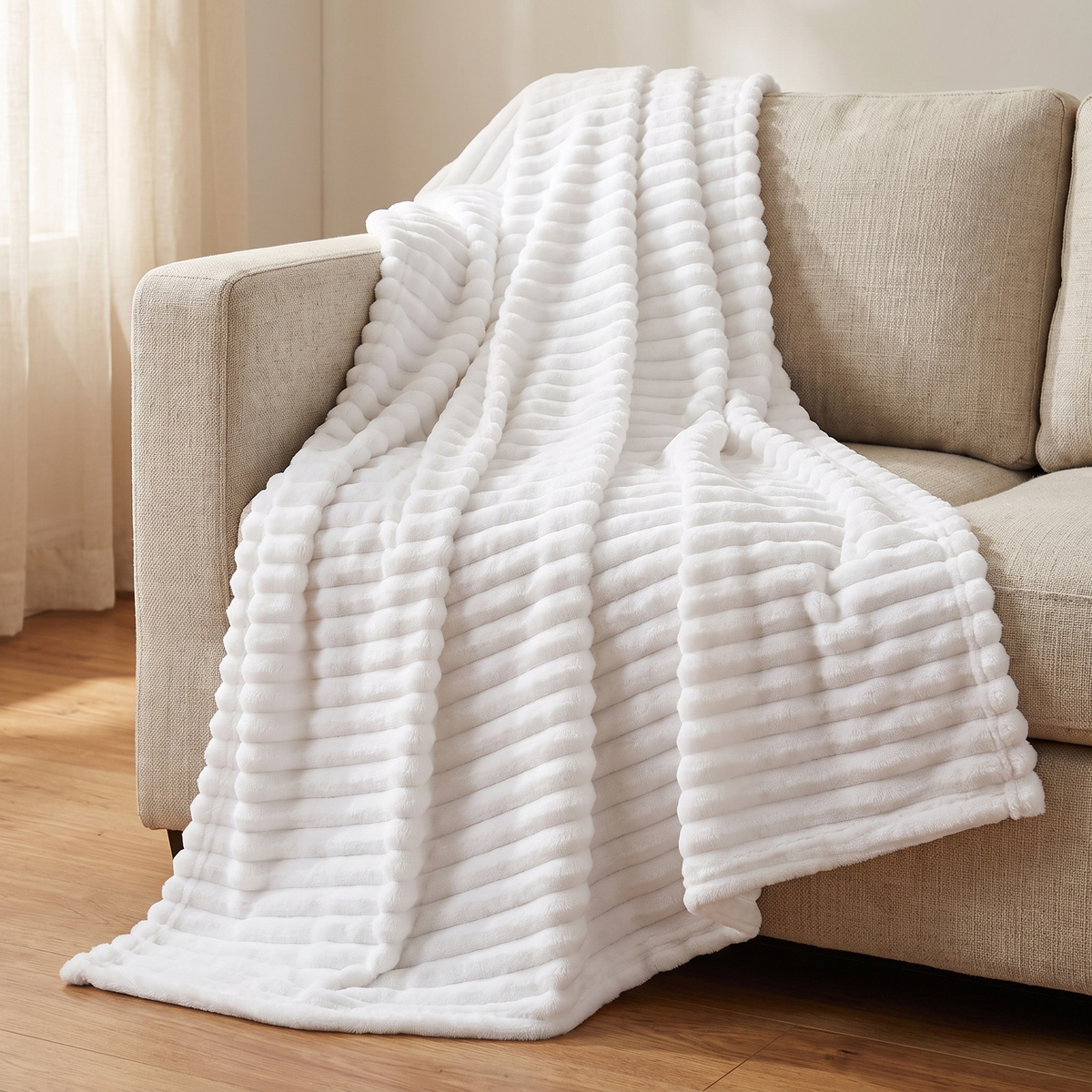 White ribbed fleece throw draped over a sofa arm