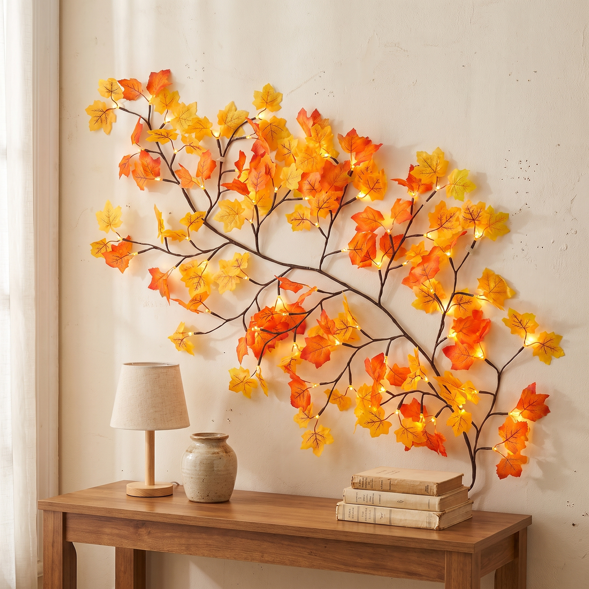 Lit maple leaf twig branch lights spread on a wall above a wood console