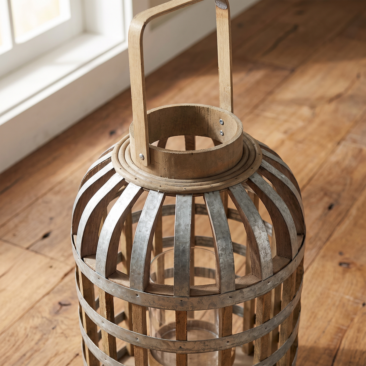 Close-up of the lantern top with wood collar, flat strap handle and metal bands